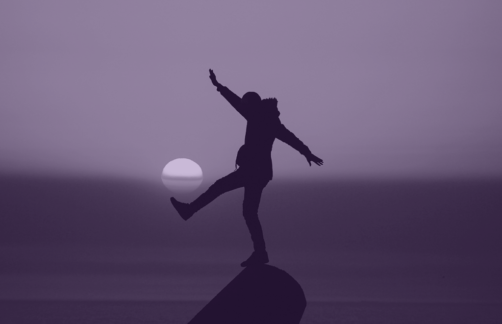 Man balancing on a rock